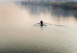 Rower on calm water Jaruna