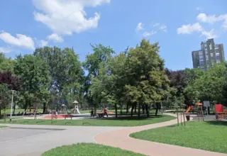Trails, lawn and playground in the Park of the 101st Brigade