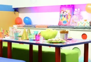 Birthday area with table and benches